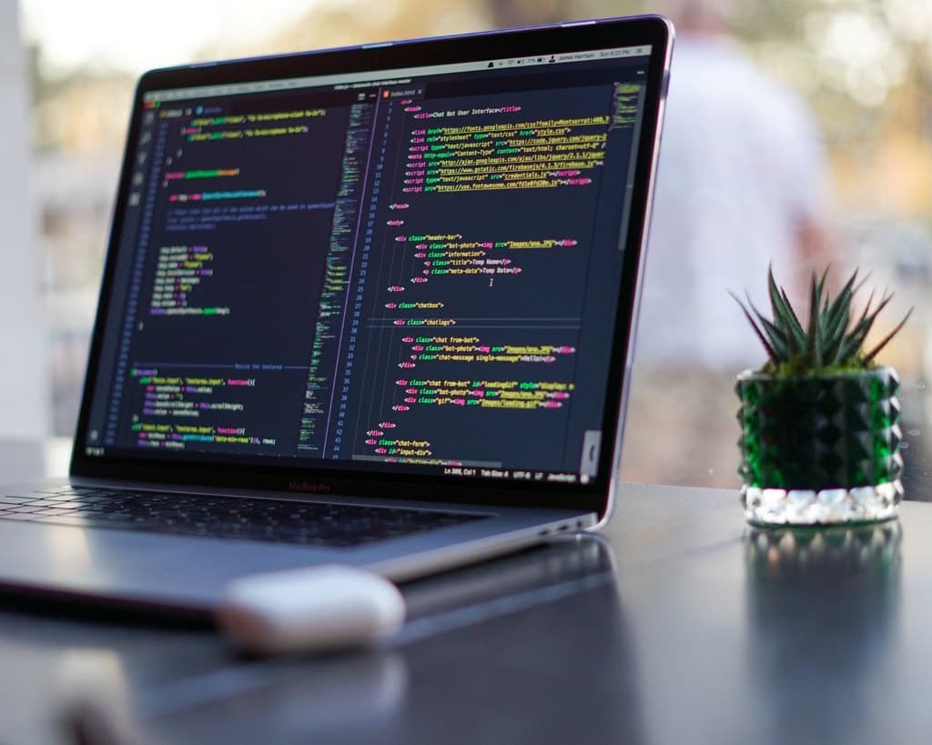 A laptop showing a code editor